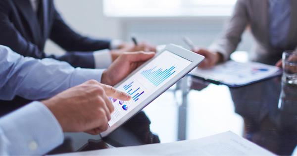 Two channel partners looking at data on tablet devices